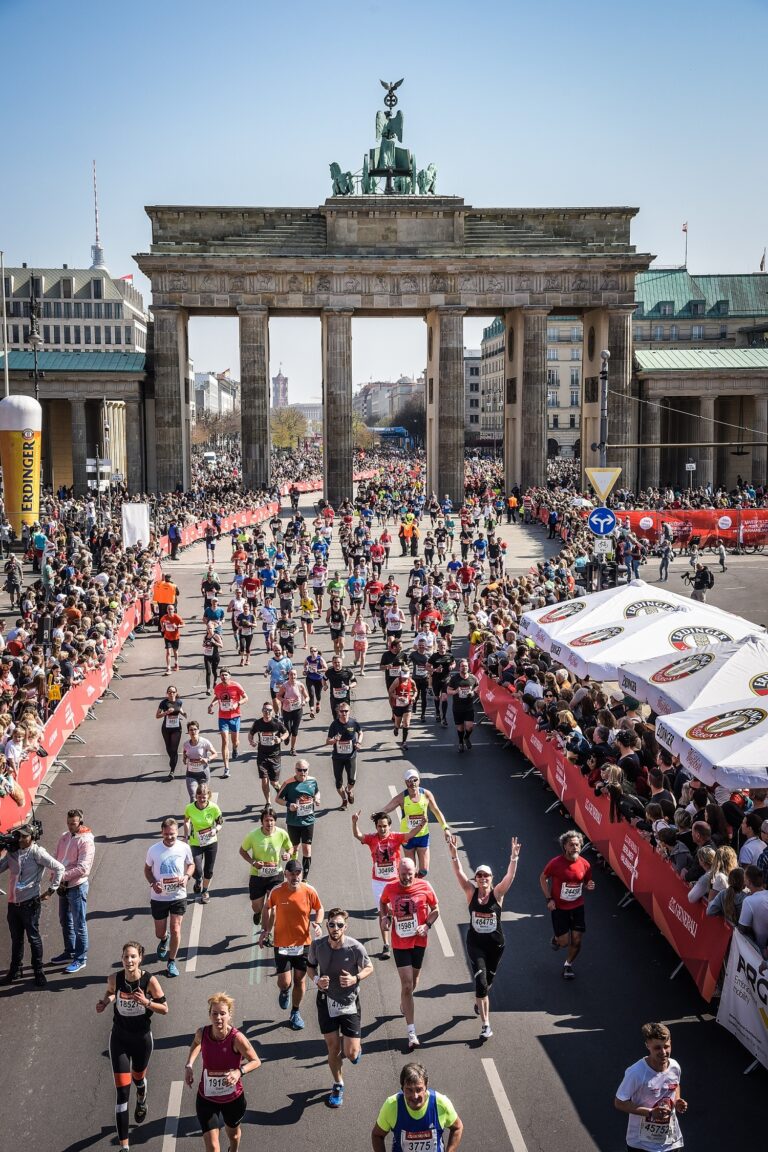 Photo of runners passing the Brandenburg Gate at the Generali Berlin Half Marathon