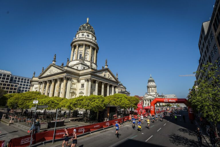 Runners passing by significant landmarks during the Berlin Half Marathon, one part of the SuperHalfs series