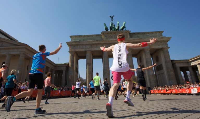 Runners cross the finish line of the Generali Berlin Half Marathon, at the Brandenburg Gate in Berlin.