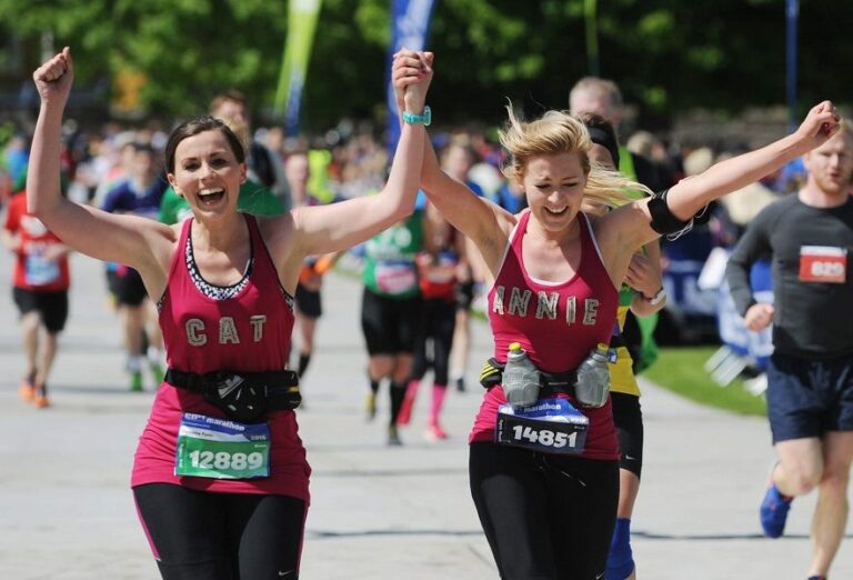 Photo of runners crossing the finishing line of the Edinburgh Marathon 2024