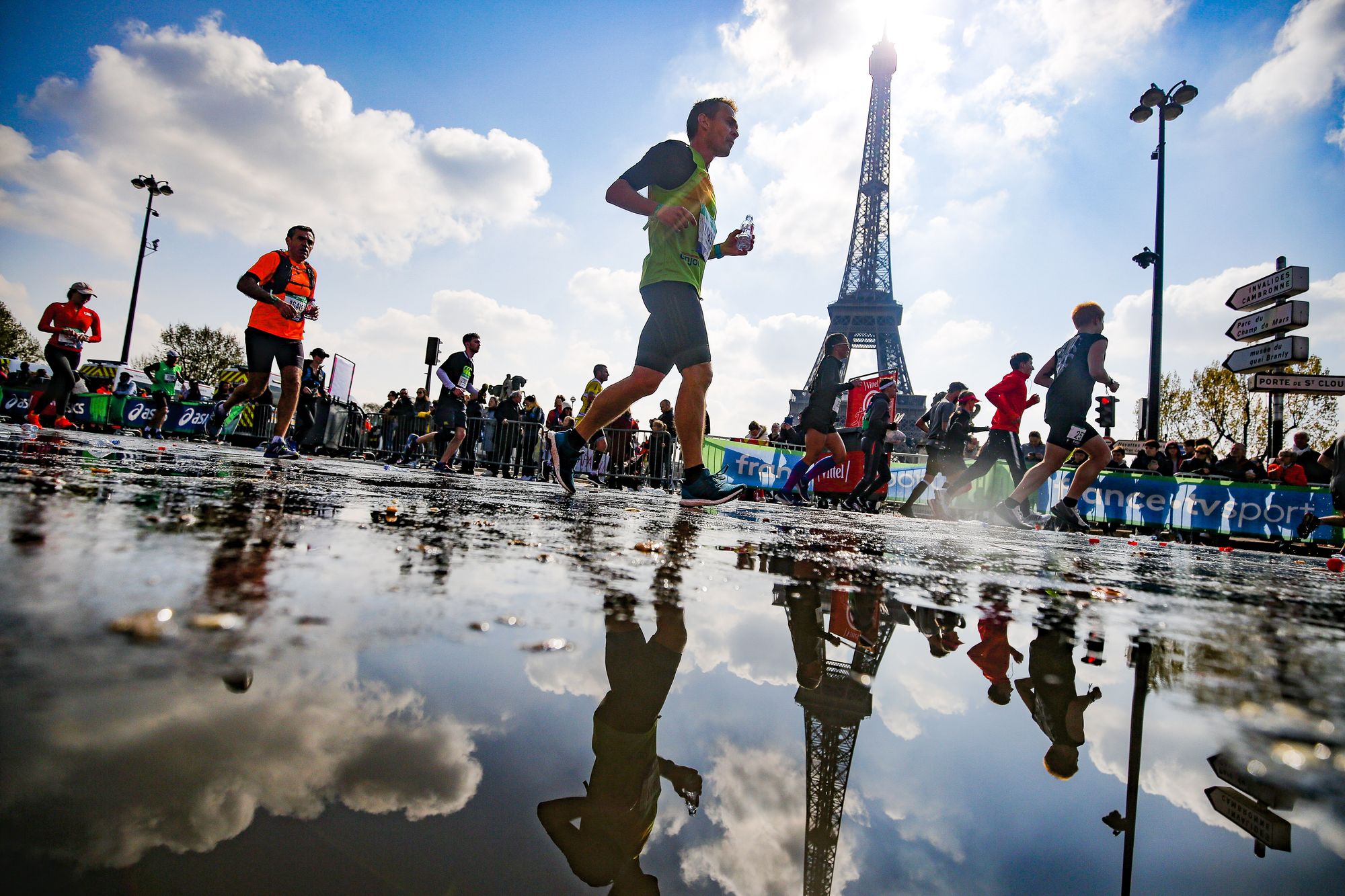 Picture of Paris Marathon runners passing the Eiffel Tower
