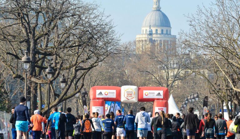 Runners approaching the finish line of the Paris Half Marathon