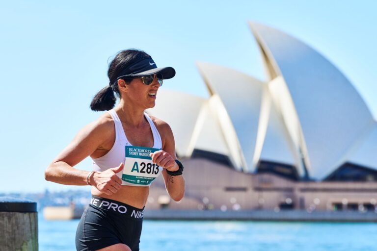 A runner passes the Sydney Opera House during the Sydney Marathon 2024