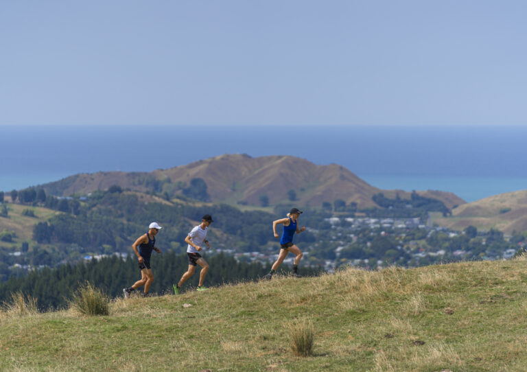 Runners climbing a hill at the First Light Marathon 2024
