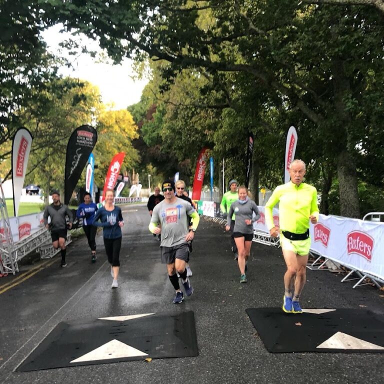 Runners approaching the finish line at the Loch Ness Marathon 2024
