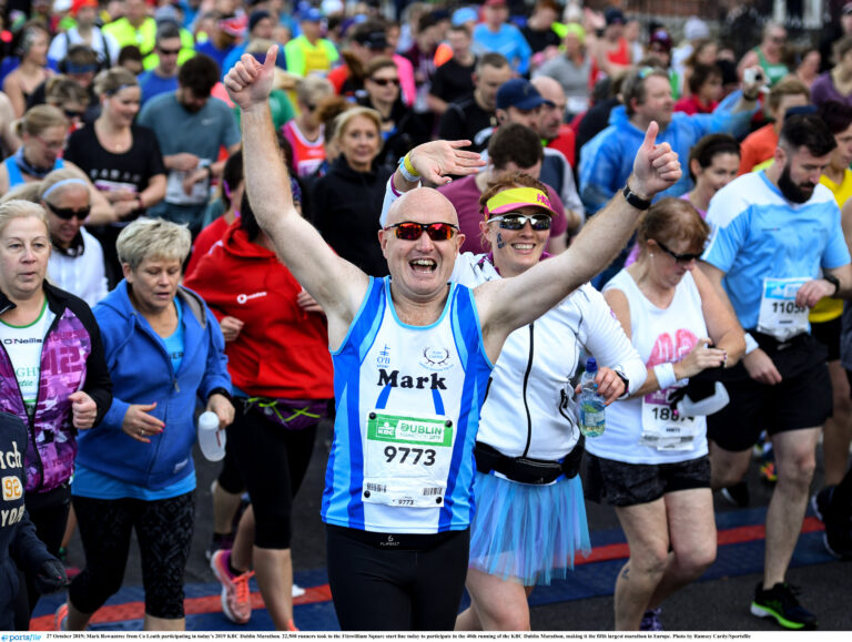 A runner celebrates at the start line of the Dublin Marathon 2024