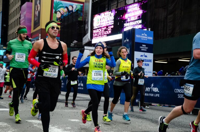 Photo of runners interacting with crowds at the New York Half Marathon