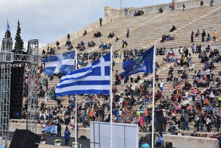 Photo of the Greek flag flying at the Athens Marathon 2024