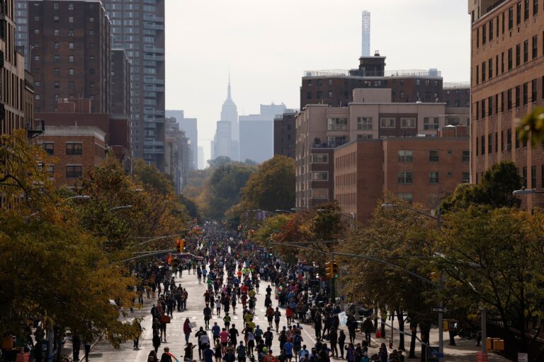 Runners running towards the New York city skyline during the New York City Marathon 2024