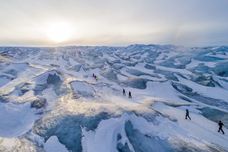 Runners crossing the Polar Circle during the Polar Circle Marathon 2024