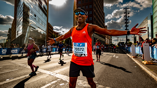 Photo of a runner celebrating after taking part in the BMW Berlin Marathon 2024