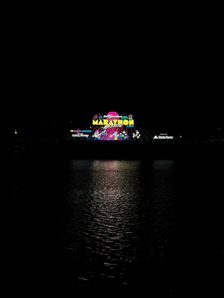 Photo of the Lake Marathon Light sign at the Walt Disney Marathon Weekend at night