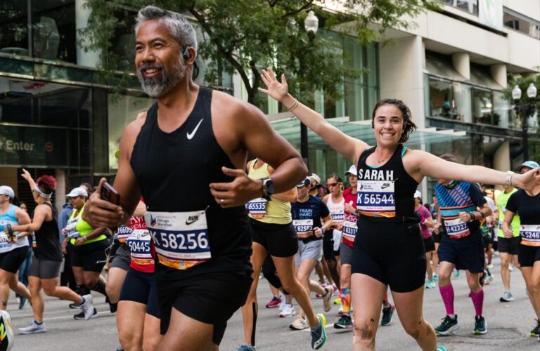 A female runner poses to camera during the Chicago Marathon 2025