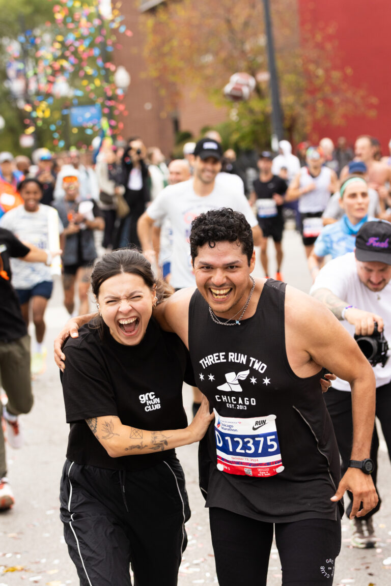 Runners embrace having taken part in the Chicago Marathon 2025