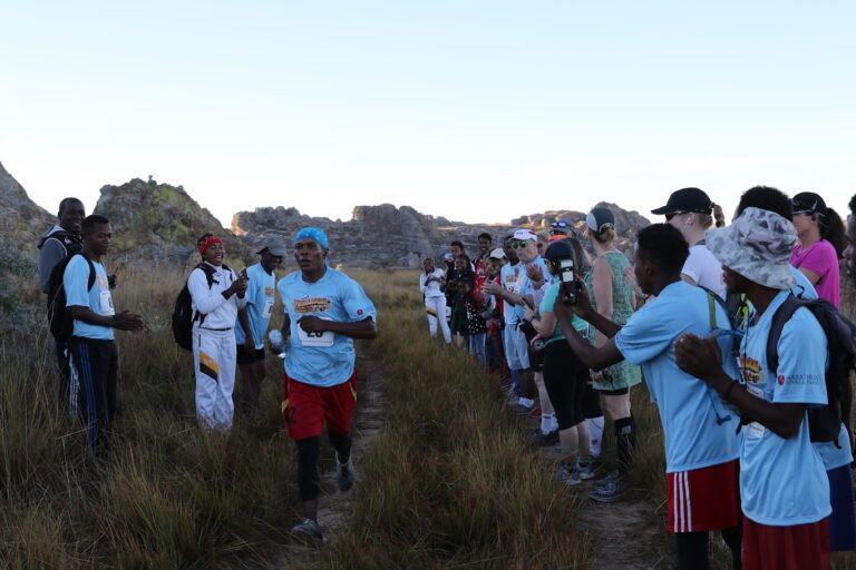 Runners being encouraged by onlooking supporters at the Madagascar Marathon 2024