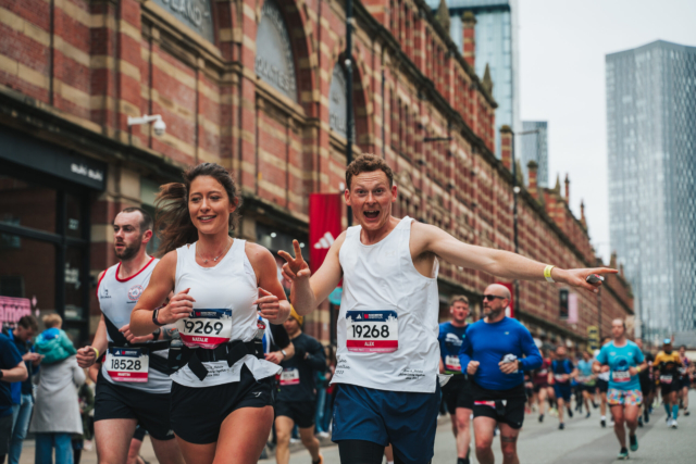 A runner posing to camera during the Manchester Marathon 2024