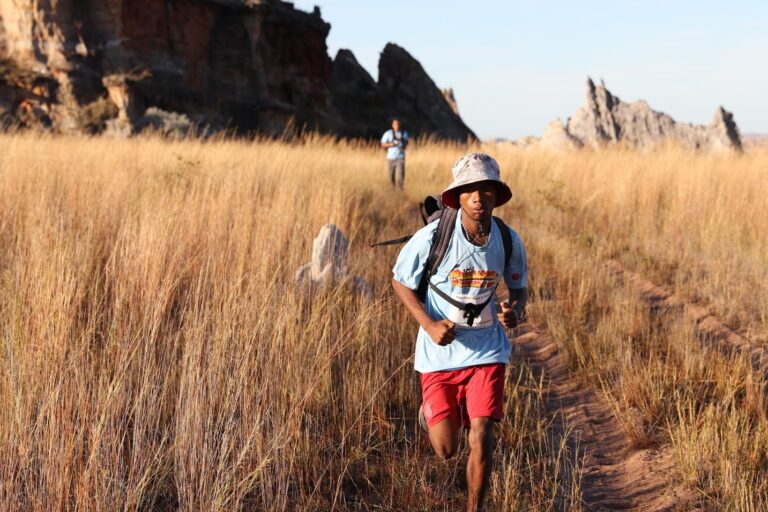 A runner passes through fields during the Madagascar Marathon