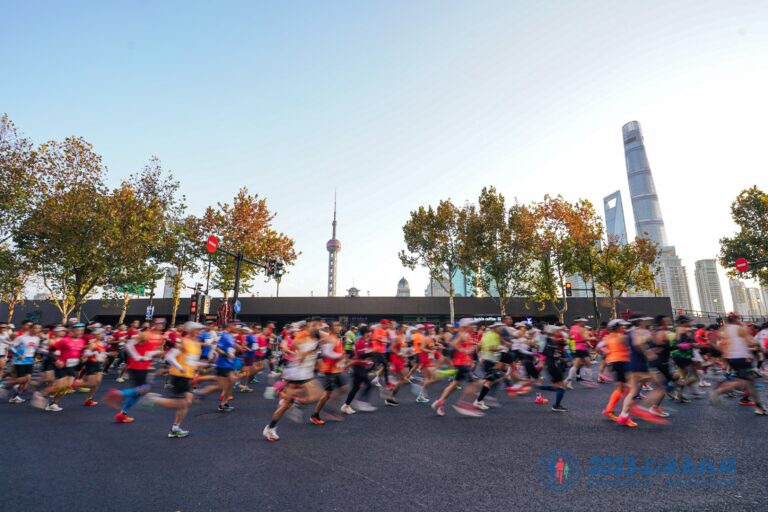 Runners pass through the centre of Shanghai during the Shanghai Marathon 2024