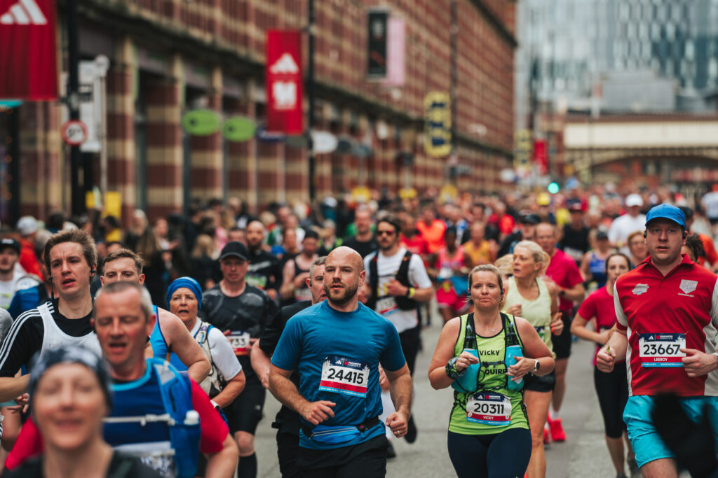 Runners pass along Deansgate during the Manchester Marathon, which will take place on the same day as the London Marathon in 2025