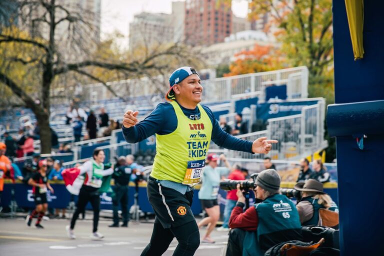 A runner celebrates having set a Marathon New York Qualification Time