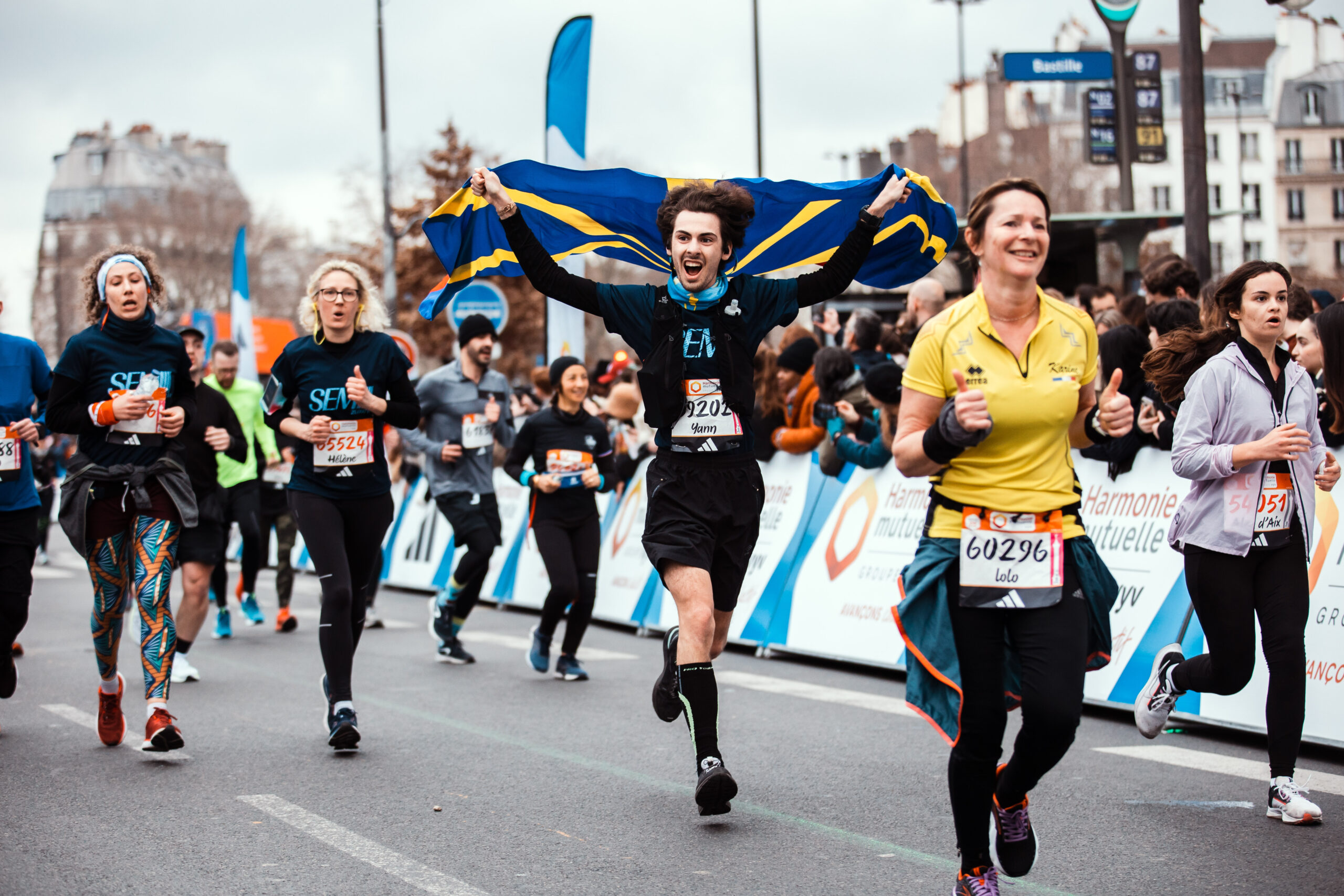 A runner crosses the finish line during a running event in Paris, with the news that there is no longer a requirement for medical certificates Paris Marathon