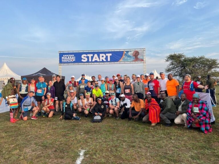 Runners pose at the start of the Amazing Maasai Marathon