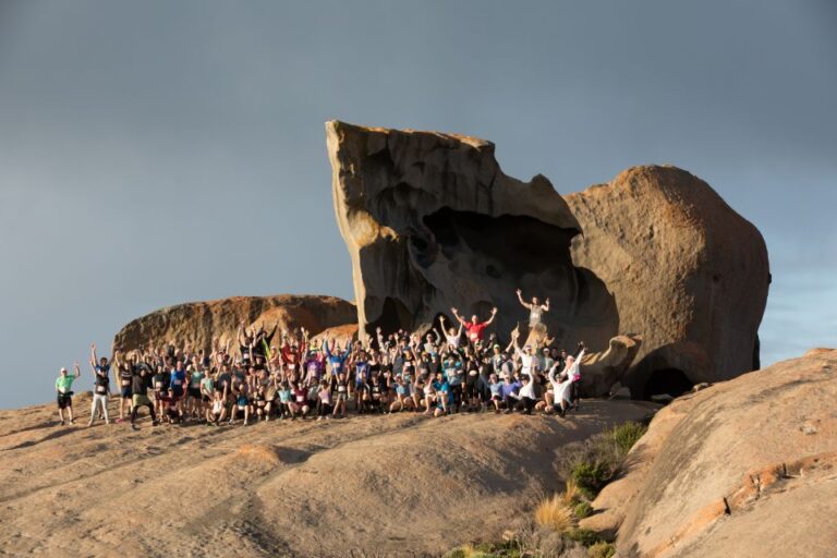 Runners posing in front of the Remarkable Rocks during the Kangaroo Island Marathon