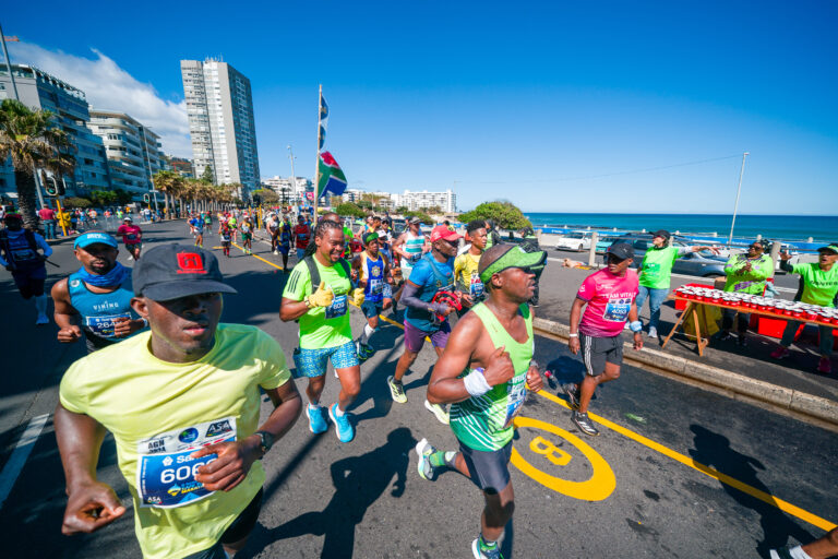 Runners passing along the shoreline during the Cape Town Marathon 2026