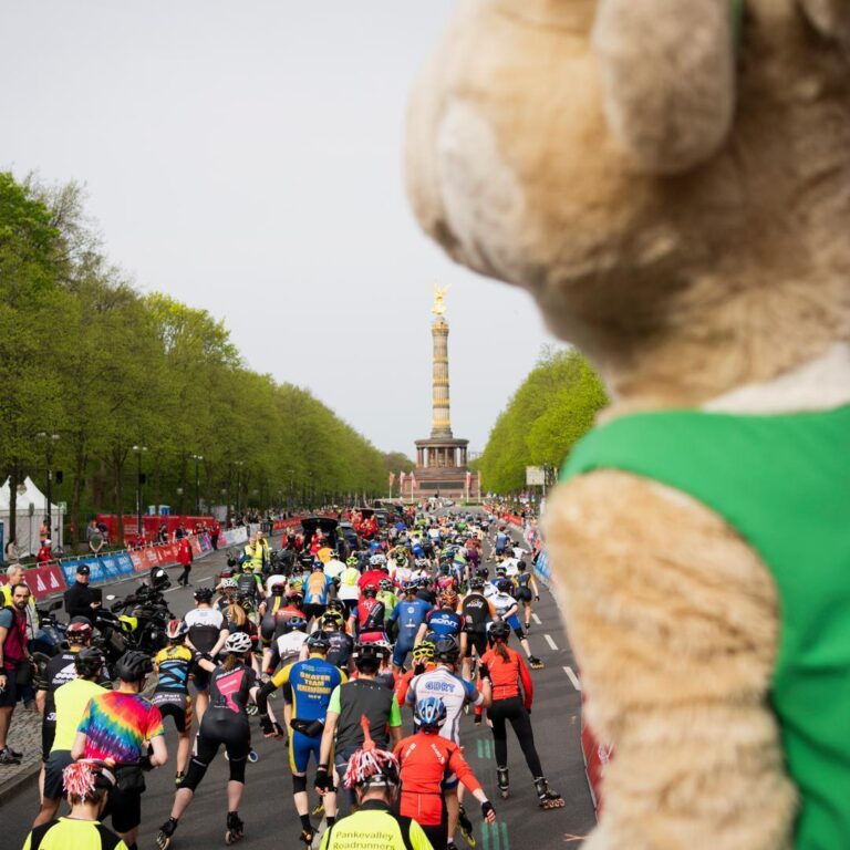 Runners heading away from the start line of the Berlin Half Marathon