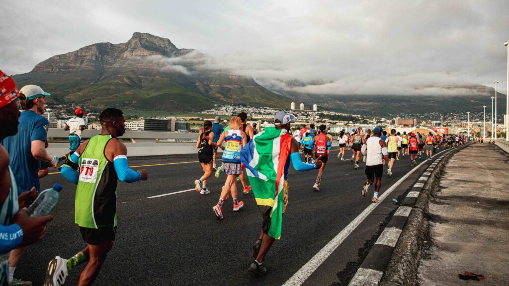 Runners passing below Table Mountain during the Sanlam Cape Town Marathon, a great London marathon alternative