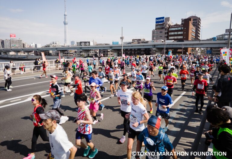 Runners cross bridge at the Tokyo Marathon