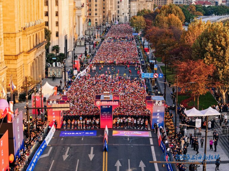 Runners wait at the start line of the Shanghai Marathon 2024