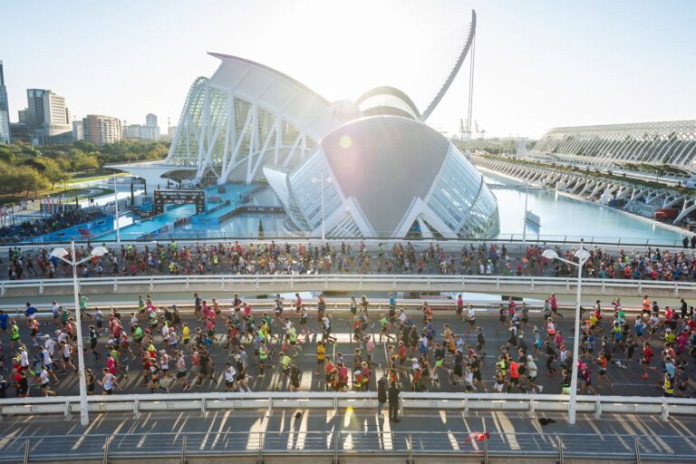 Runners passing stunning architecture during the Valencia Marathon 2024