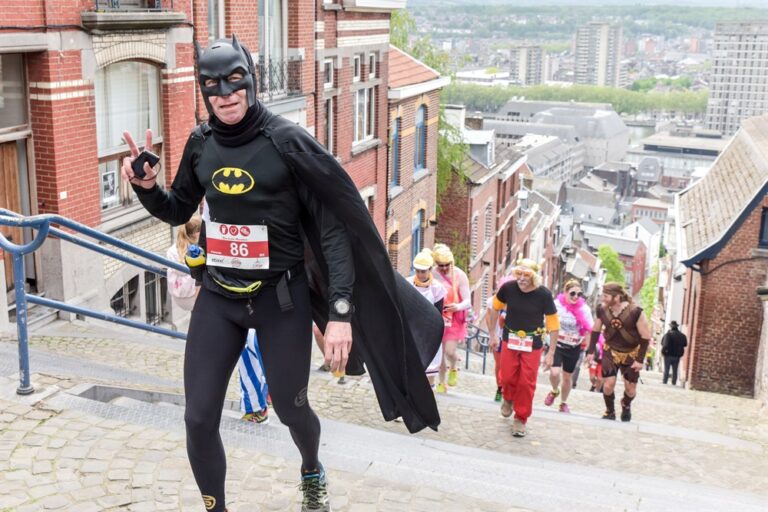 A runner dressed as Batman taking part in the Beer Lovers Marathon