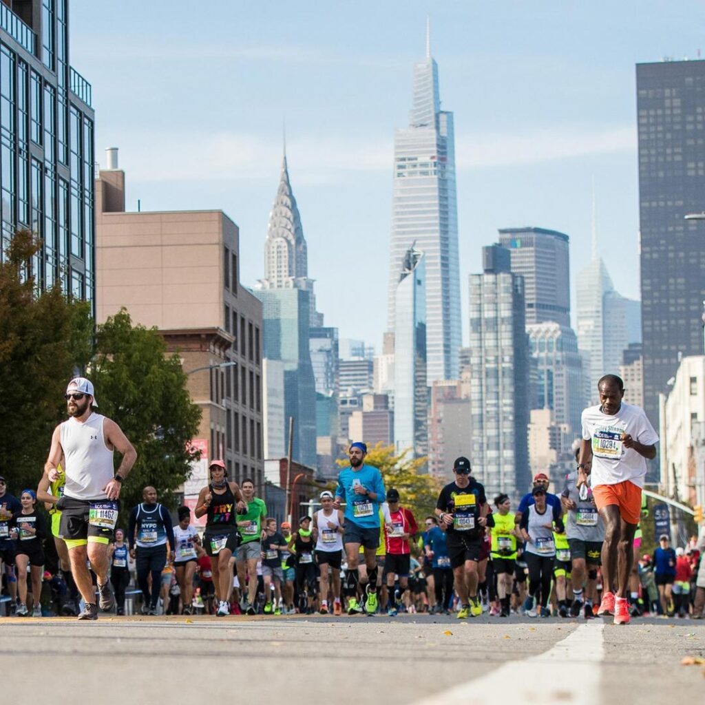 Runners passing in front of the New York skyline during the New York City Marathon