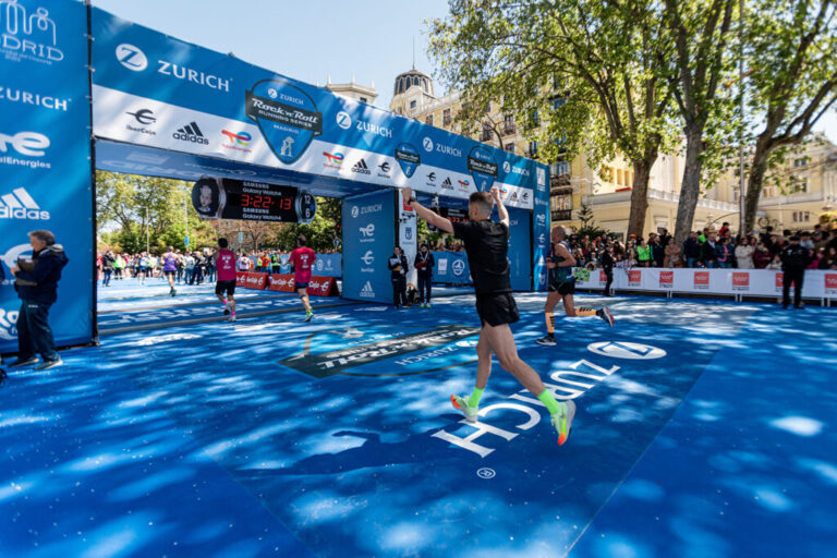 A runner celebrates crossing the finish line at the Madrid Marathon 2027