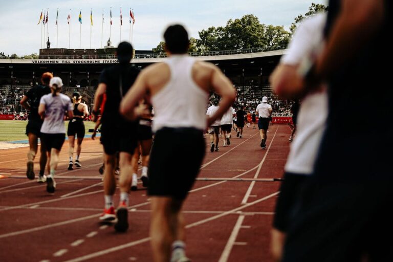 Runners approaching the finish line of the Stockholm Marathon in the city's Olympic Stadium