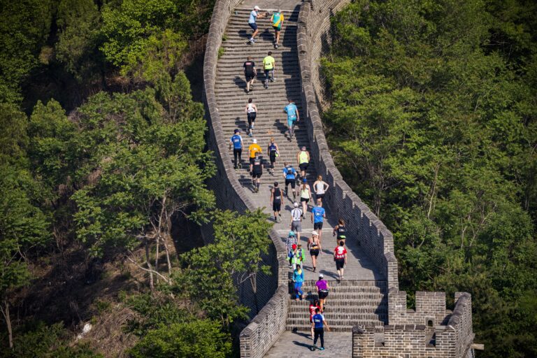 Runners traverse steps of the Great Wall of China during the Great Wall Marathon