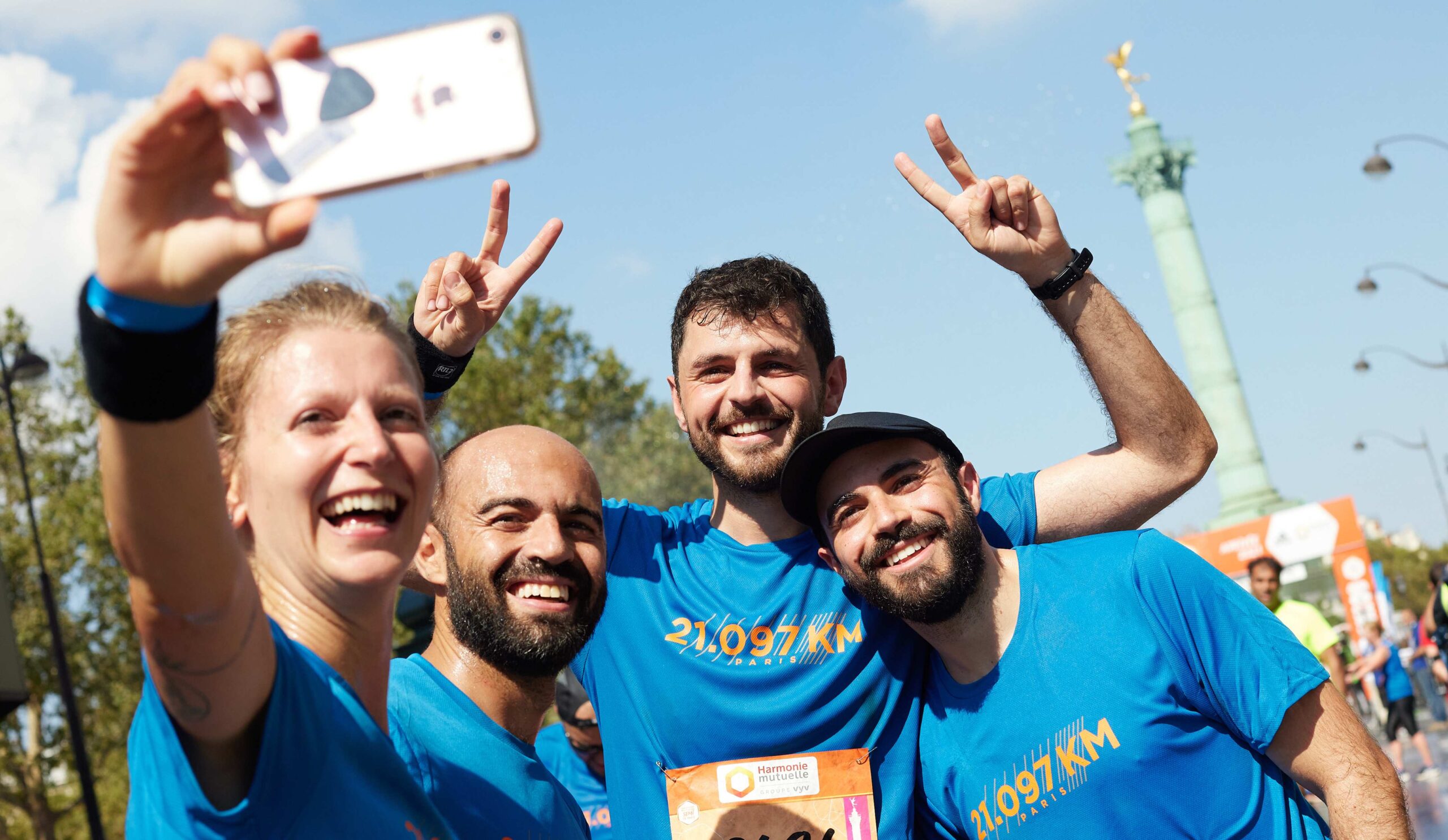 Runners pose for a photo having taken part in the Paris Half Marathon