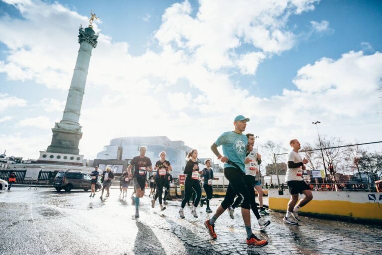 Runners passing through the streets of Paris during the Paris Half Marathon