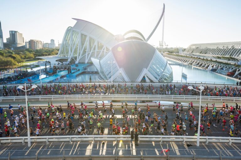 Runners passing stunning architecture during the Valencia Marathon
