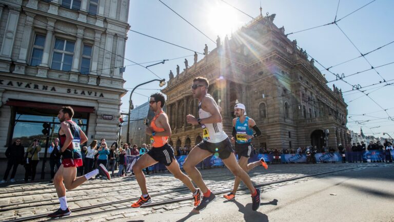 Runners passing through the centre of Prague during the Prague Half Marathon, one part of the SuperHalfs series